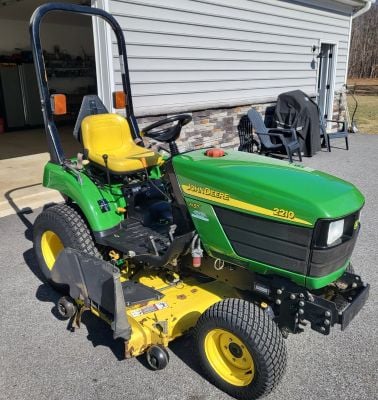 John Deere 2210 tractor with mower and snow blower