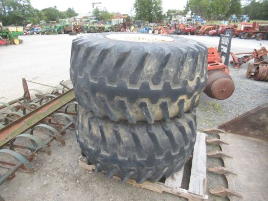 pair of 48-25.00-20 tires on truck rims
