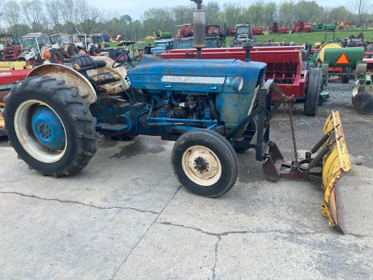 Ford 2000 tractor with front blade