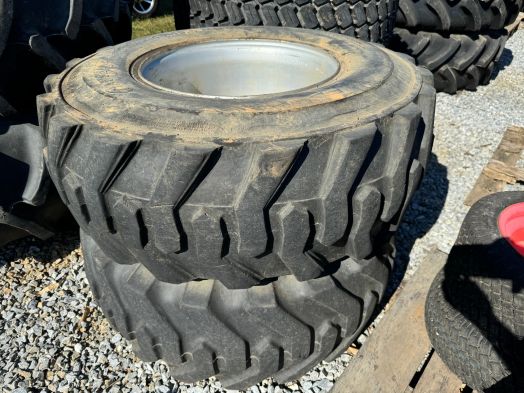 Pair of 15-19.5 14 ply loader tires on rims