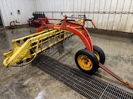 New Holland 258 RolaBar rake with dolly wheel