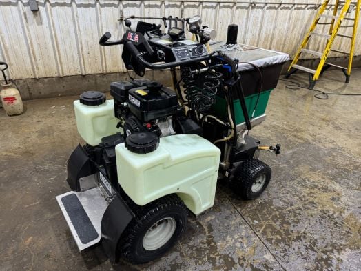 Lesco stand on spreader with Subaru engine