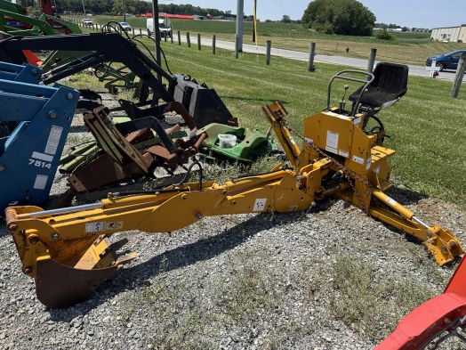 Yellow 3pt backhoe with pump