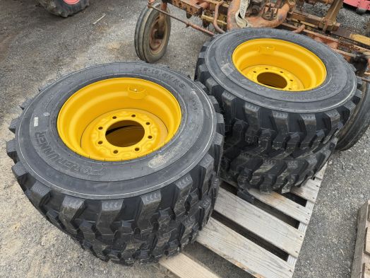 4 new 12-16.5 skid loader tires on rims