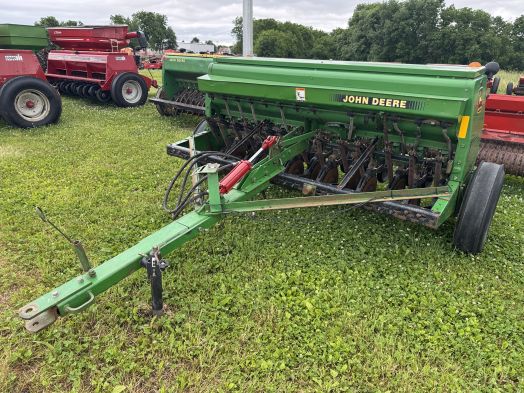 John Deere 450 8' grain drill with grass box and press wheels.