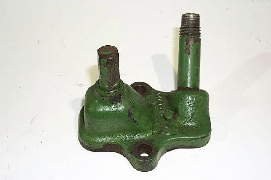ADJUSTING SCREW AND DIPSTICK TUBE HOUSING